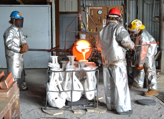 Pouring the bronze for the sculpture bust